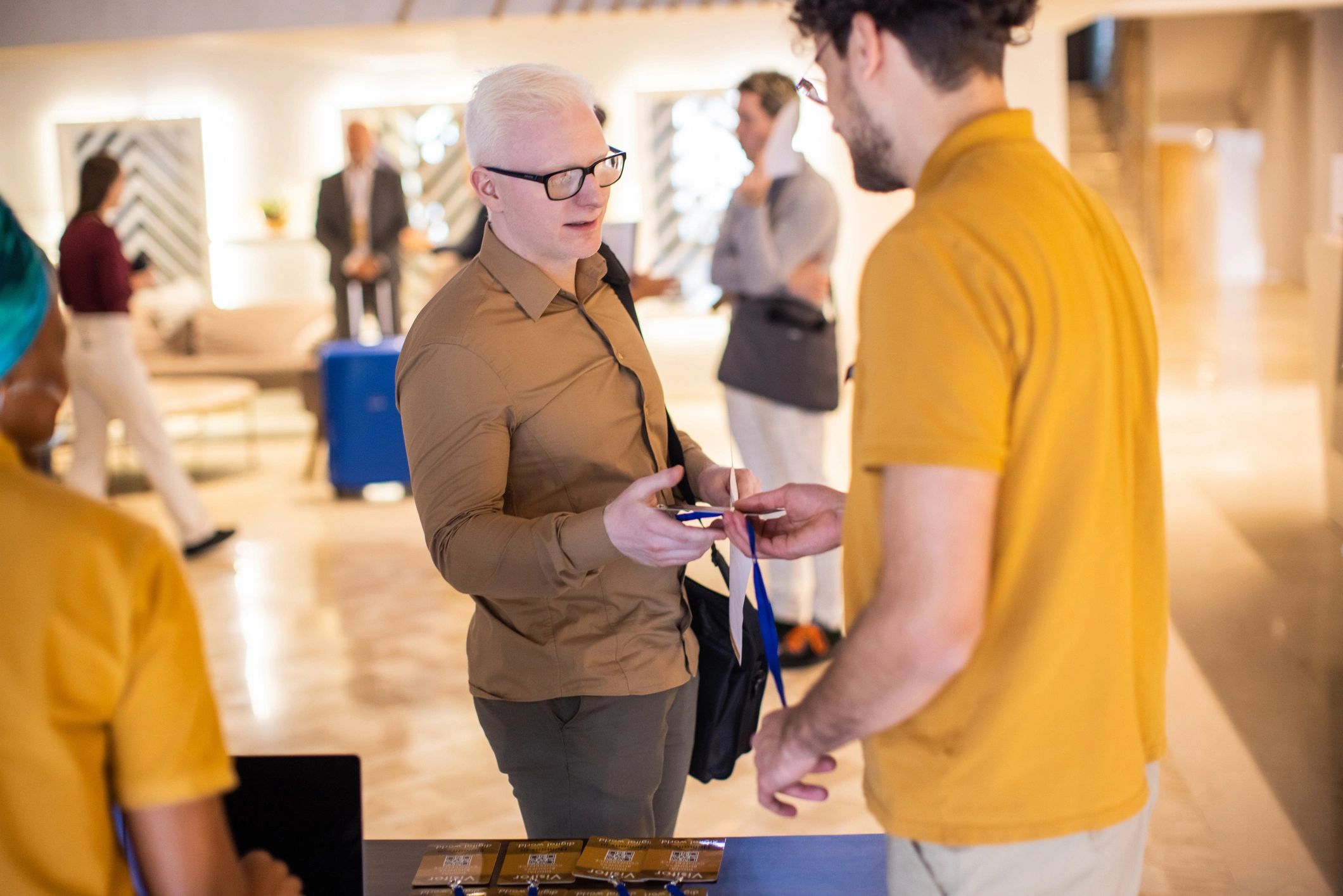 People checking in at an event